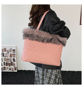 Detail of pink quilted tote bag with faux fur trim and shiny diamond stitching texture