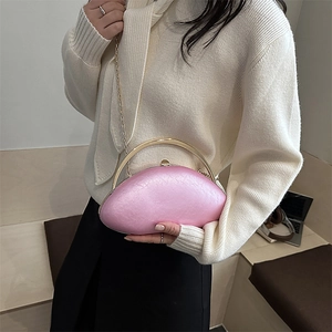 Pink shell-shaped evening clutch bag with gold handle and chain strap for women