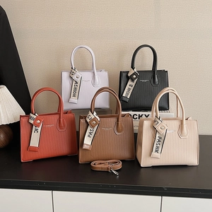 Chic textured leather tote bags in multiple colors with fashion straps and top handles