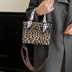 Chic leopard print handbag with silk scarf handle and wide jacquard shoulder strap
