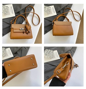 Detail shots of brown leather Kelly bag with herringbone texture and heart charm