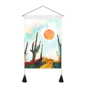 Detailed texture of Nordic wall tapestry with abstract cactus art and black tassels