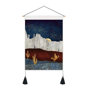 Detail of Nordic tapestry with abstract mountain desert art and black side tassels