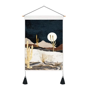 Detail of desert moon landscape tapestry with golden cactus and black silk tassels