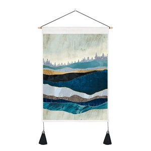 Detail of Nordic tapestry featuring abstract mountains, pine silhouettes and golden lines