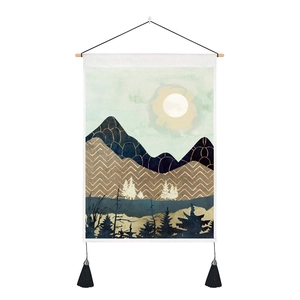 Close-up of minimalist abstract mountain tapestry with wooden pole and black tassels