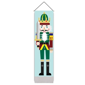Close-up of Nutcracker soldier tapestry with classic Christmas motifs and bottom tassels