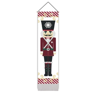 Detailed view of nutcracker soldier wall tapestry with red uniform and bottom tassels