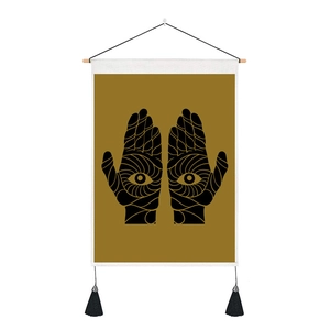 Bohemian tapestry featuring mystic eye hands design on gold fabric with black tassels