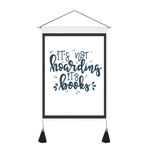 Detail of inspirational quote wall tapestry with wooden frame and black tassels