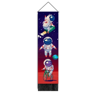 Detailed view of astronaut tapestry with wood pole and black tassel decorations