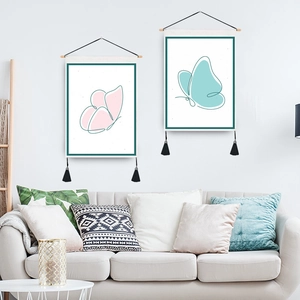 Modern minimalist wall art set featuring butterfly prints with wooden frames and tassels
