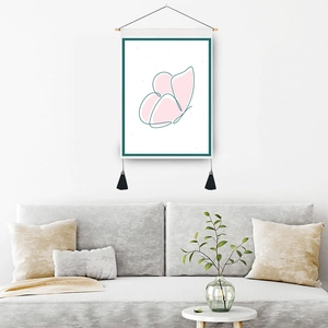 Modern pink butterfly canvas tapestry with wood rod and tassels in a bright living room