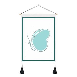 Macro detail of butterfly wall hanging with wooden rod and black decorative tassels