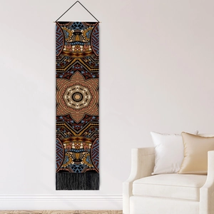 Bohemian mandala wall tapestry with dark blue patterns and black tassels on white wall