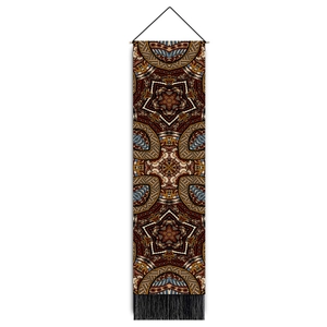 Detail of bohemian mandala tapestry featuring geometric patterns and black bottom tassels