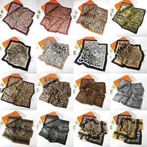 Collage of 16 different leopard and animal print satin square scarves in various colors