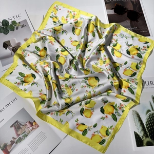 70cm square silk scarf featuring bright lemon prints with elegant yellow borders