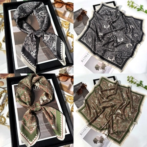 Detail of square silk scarf featuring vintage paisley patterns in diverse color palettes