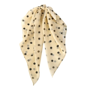 Elegant polka dot chiffon neck scarf in cream and black with a soft knotted drape