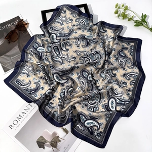 70cm navy paisley square silk scarf styled with magazine and sunglasses on white surface