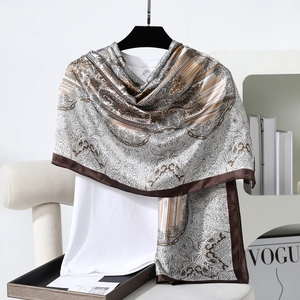 Detail of elegant paisley satin scarf with silky texture and vintage floral print patterns
