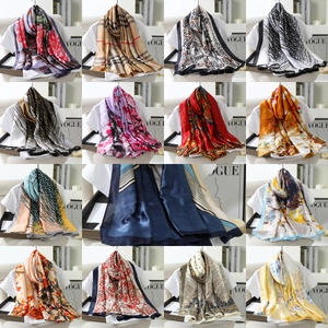 Collage of long silk-feel scarves with diverse vintage paisley and floral patterns