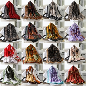 Collage of long silk scarfs with paisley, floral, and geometric patterns for women