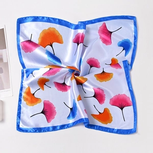 50cm square silk satin scarf featuring bright blue borders and ginkgo leaf patterns
