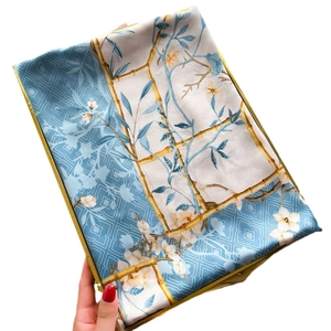 Elegant sky blue silk scarf with white magnolia floral print and bamboo border design