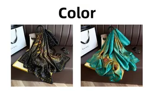 Detail of silk-like long scarves with vintage feather patterns in black and green gold