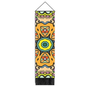 Tribal mandala tapestry with colorful geometric patterns and black decorative tassels