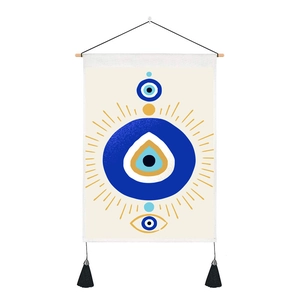 Artistic Evil Eye wall tapestry with blue patterns, wooden rod and black tassels