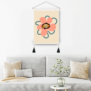 Abstract pink bloom wall tapestry with wooden rod and black tassels on a white wall