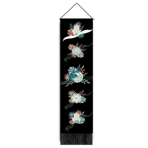 Vertical bohemian wall hanging featuring moon phases and Hamsa hand on black fabric