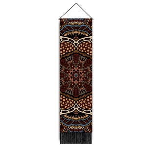 Detail of bohemian mandala tapestry with wooden hanging rod and long black tassels