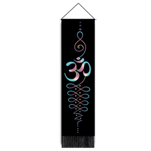 Detailed view of black tapestry with gold Om symbol, spiritual patterns and black tassels