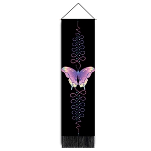 Close-up of bohemian butterfly tapestry with purple gradient print and black tassels