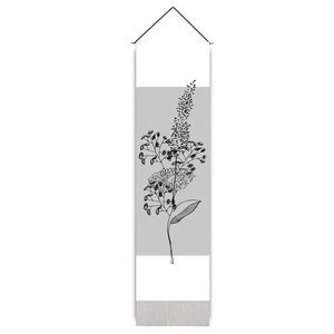 Macro detail of Nordic floral wall tapestry featuring black line art and tassels