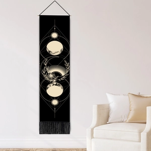 Nordic sun and moon phase wall tapestry with black tassels and a wooden hanging pole