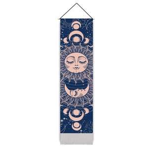 Detail of mystical sun and moon tapestry with dark blue canvas and wooden hanger