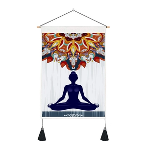 Detail of wooden hanging rod and black tassels on the mandala yoga meditation wall scroll