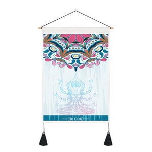 Detailed texture of bohemian yoga tapestry with mandala pattern and black decorative tassels