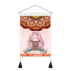 Detail of meditation yoga wall tapestry with mandala pattern and black tassel accents