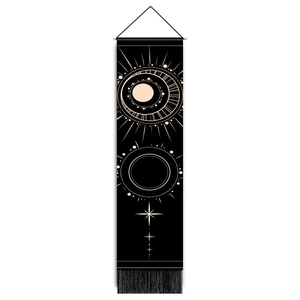 Vertical black tarot tapestry with golden sun and moon patterns, wooden rod, and tassels