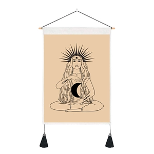 Bohemian moon goddess wall tapestry with solar symbols and black fringe accents