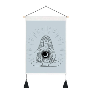 Detail of meditation tapestry with moon phases goddess and black tassel accents