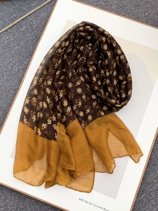 Detail view of vintage floral voile scarf with brown patterns and yellow border highlights
