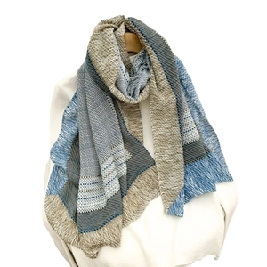 Striped cotton linen scarf with blue and beige texture and fringe on white background