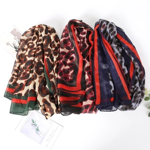 Set of three leopard print chiffon scarves with red striped borders and retro patterns